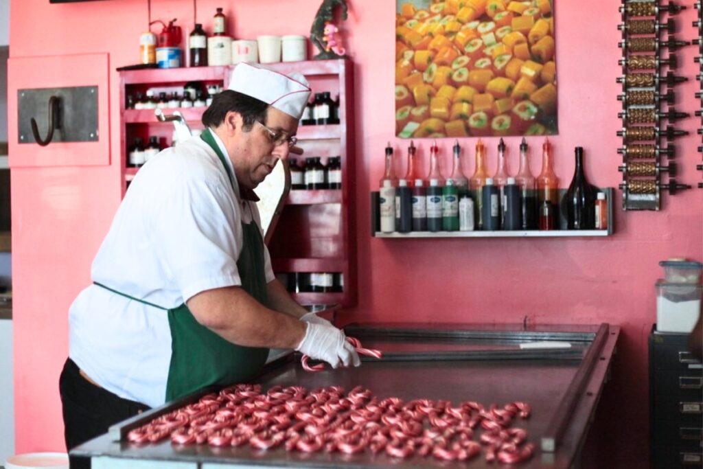 Candy cane maker Greg Cohen of Lofty Pursuits hard at work making his candy.