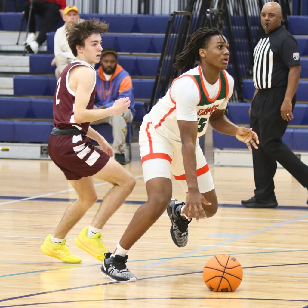 Eastside's Jarrel Comer drives past Oak Hall's Ryan McKinney at the Hitchcock's Challenge.