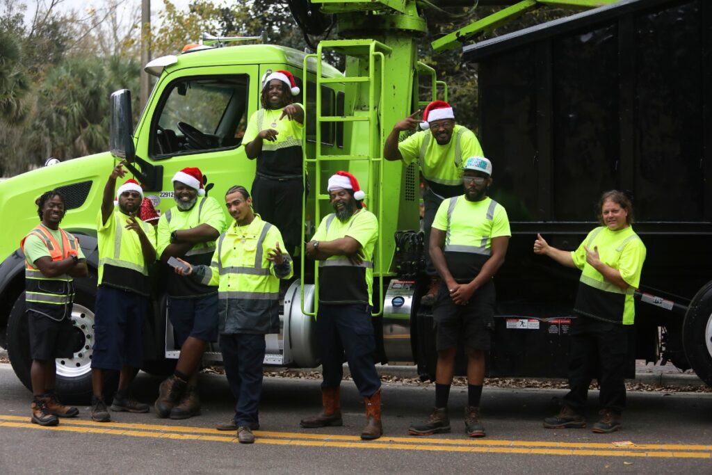 Employees with the GFL Environmental at A Very GNV Holiday Parade on Saturday.