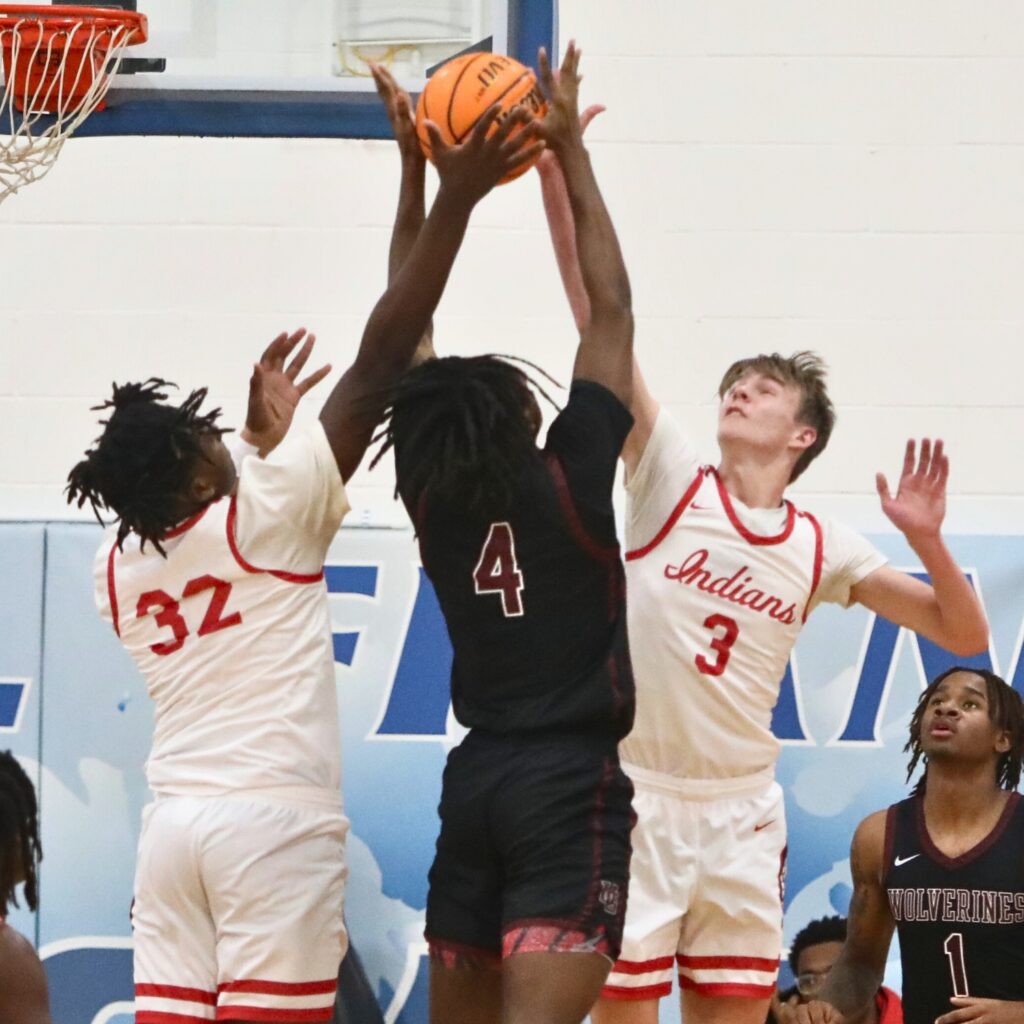 Fort White's Dreyson Lally (32) and Garrett Brady (3) battle for a rebound against Union Grove (GA) at the Florida Get Down Showcase.
