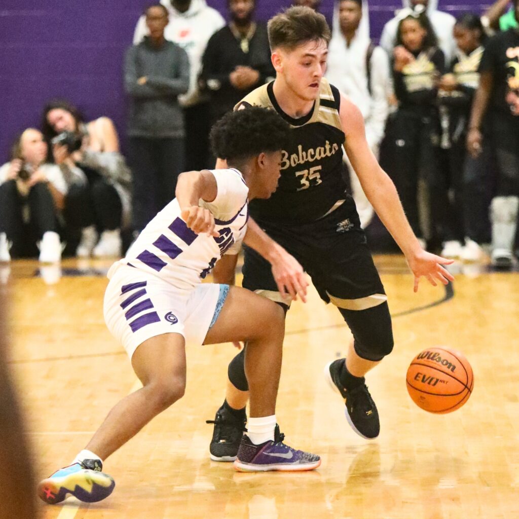 Gainesville's Jacob Wright battles Buchholz's Palmer Walton for the ball on Friday.
