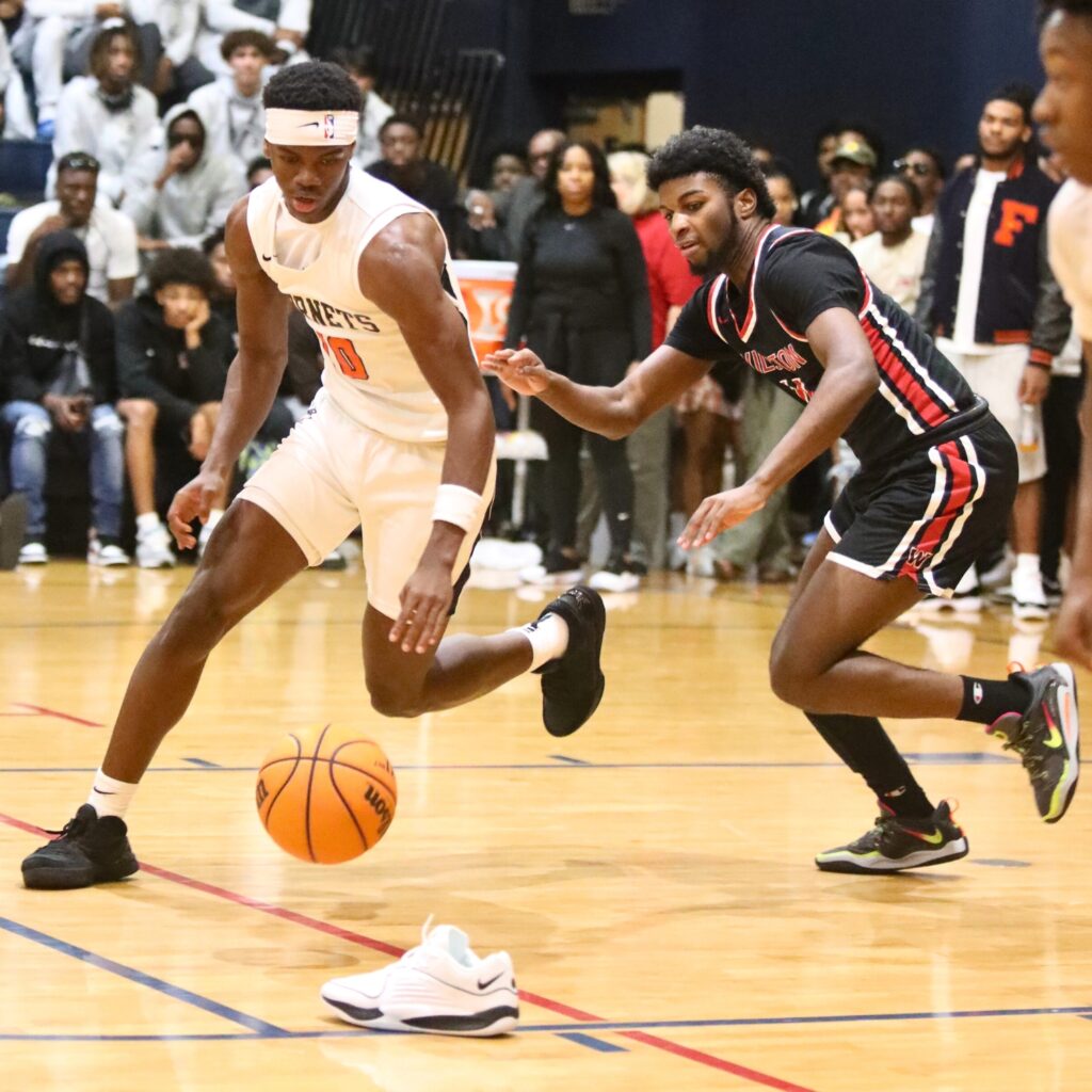 Hawthorne's C.J. Ingram snags a loose ball while dribbling around teammate Caleb Rollerson's shoe against Williston.
