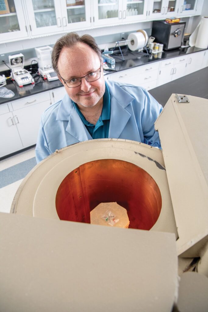 Jim Baciak stands in his lab.