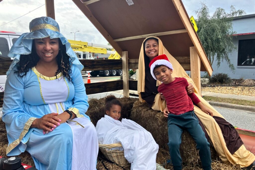 Judge Meshon Rawls (as Mary), Prince Jackson (as Jesus) , Dr. Carjie Scott and Kerwin Scott on the Bethel AME float at A Very GNV Holiday Parade on Saturday.