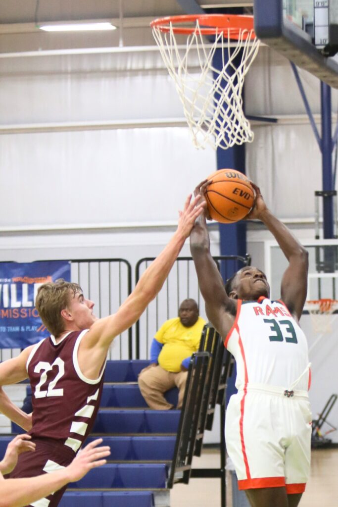 Oak Hall's Andrew Powell attempts to block a shot by Eastside's Davion Pugh at the Hitchcock's Challenge.