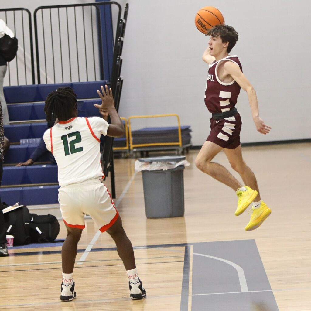 Oak Hall's Ryan McKinney attempts to save the ball from going out of bounds against Eastside at the Hitchcock's Challenge.