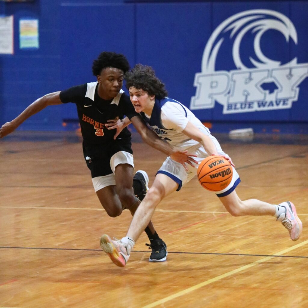 P.K. Yonge's Jantzen Griffin drives past Hawthorne's Dacarion Debose.