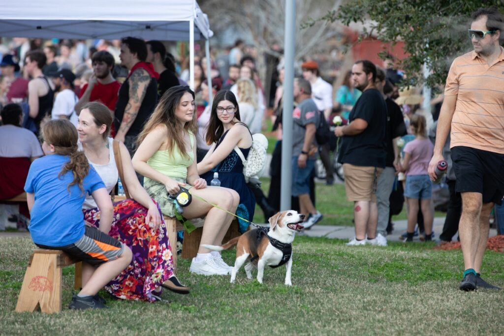 A dog becomes excited as its master approaches following a bathroom break.