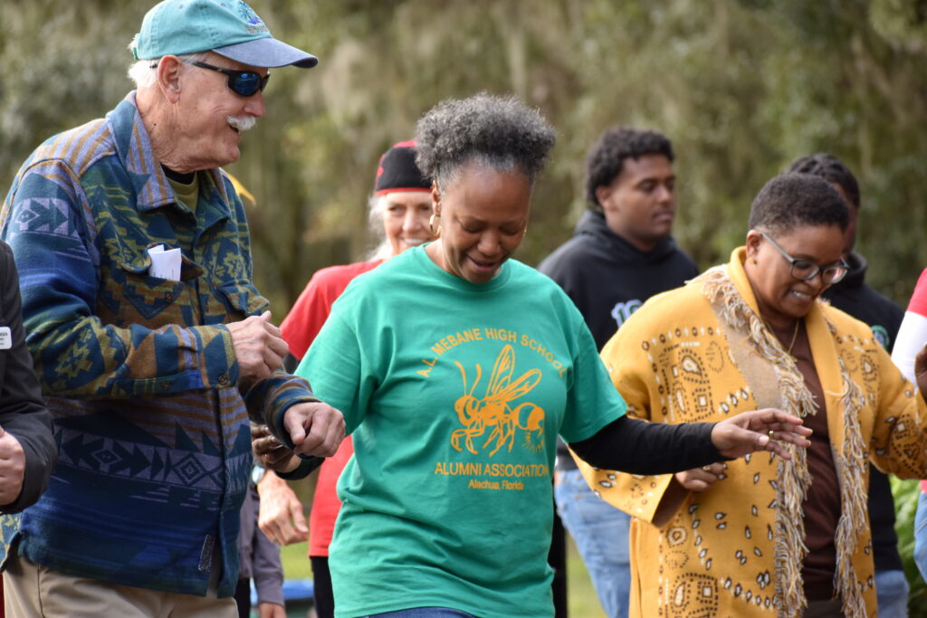 Alachua Mayor Gib Coerper (left) dances the Cupid Shuffle with Smooth Flava Dance.