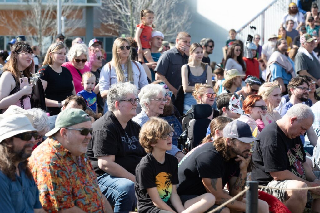 Audience members marvel at the Living Chessboard tournament at the Hoggetowne Medieval Faire.