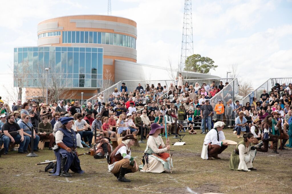 Audience members marvel at the Living Chessboard tournament.