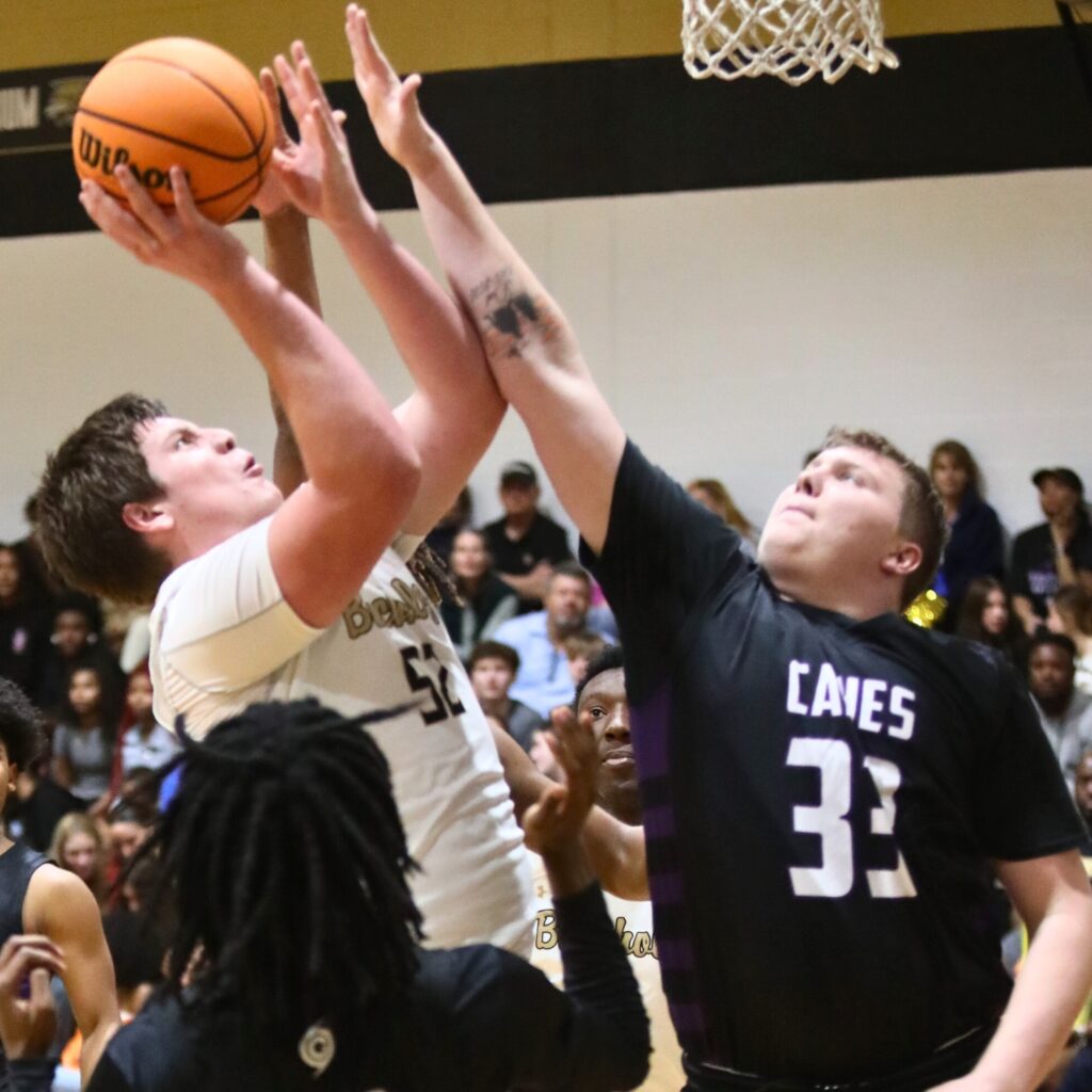 Buchholz's Dylan Lloyd attempts a shot against Gainesville's Aiden Bell.