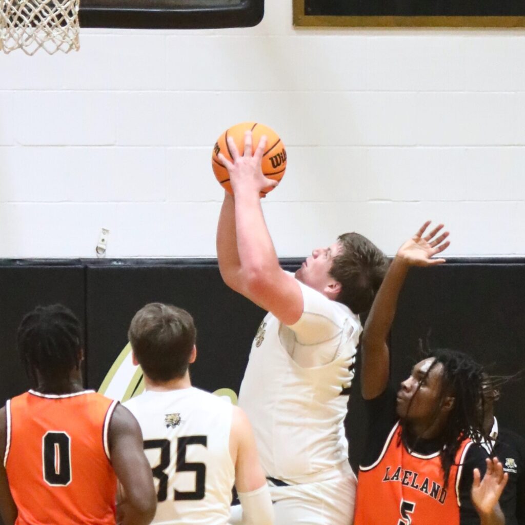 Buchholz's Dylan Lloyd shoots for two against Lakeland.