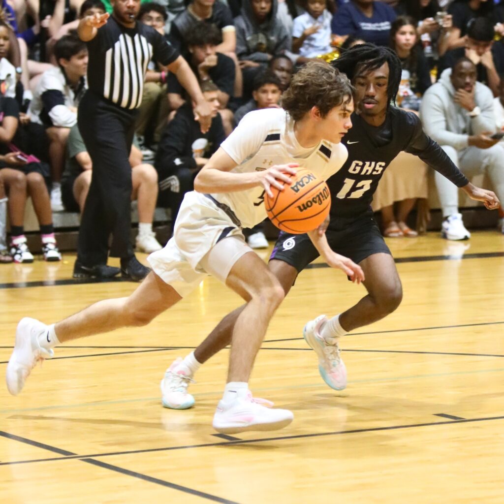 Buchholz's Lucas Bhatia takes the ball up court against Gainesville's Brendan Bloodworth.
