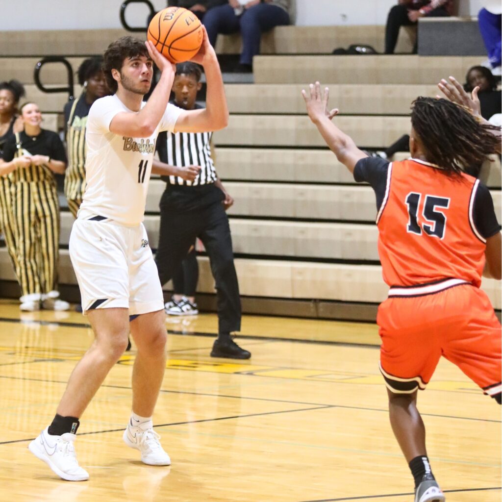 Buchholz's Nate Muchnick spots up for one of his 3-point shots against Lakeland.