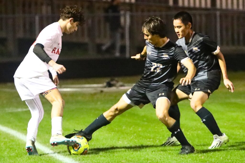Buchholz's Nicholas Rossi takes the ball away from Santa Fe's Giacomo Burgetto.