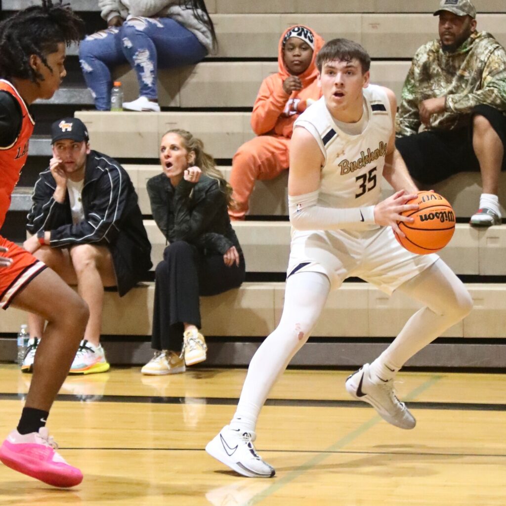 Buchholz's Palmer Walton steps away from a Lakeland defender to shoot a 3-pointer.