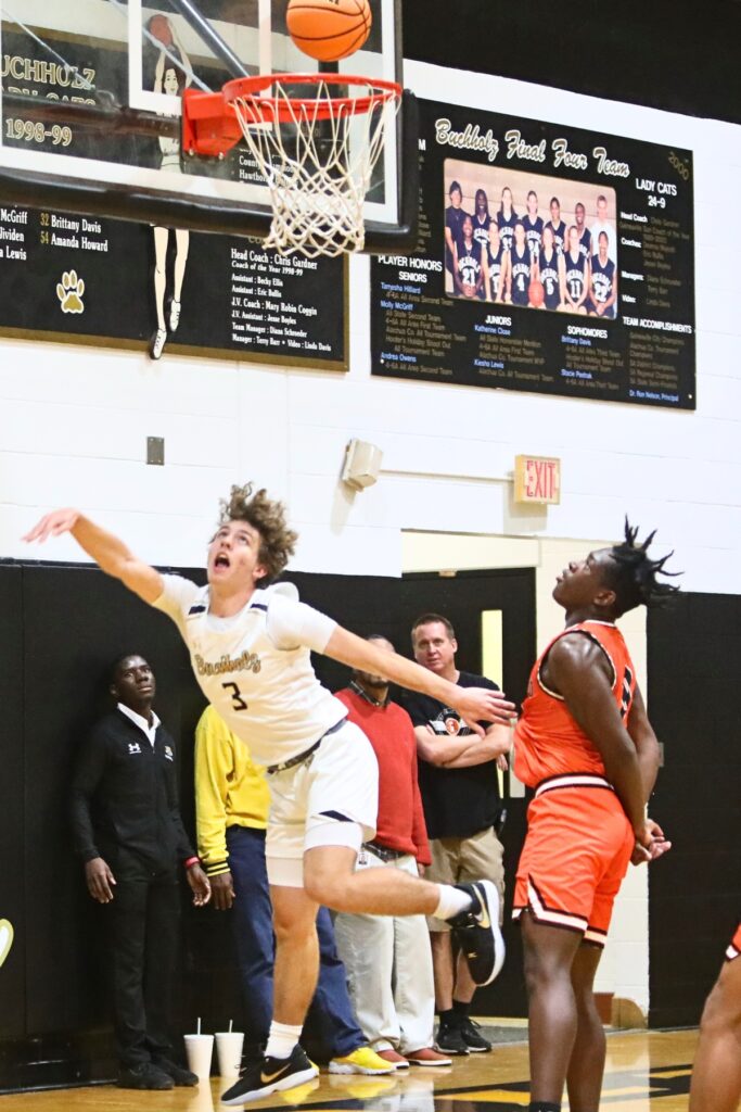 Buchholz's Will Stanaland scores a basket after a steal against Lakeland.