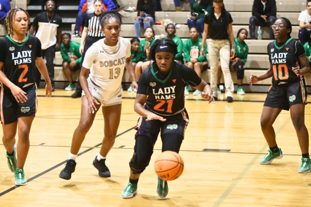 Eastside's Precious Marshall tracks down a loose ball against Buchholz.