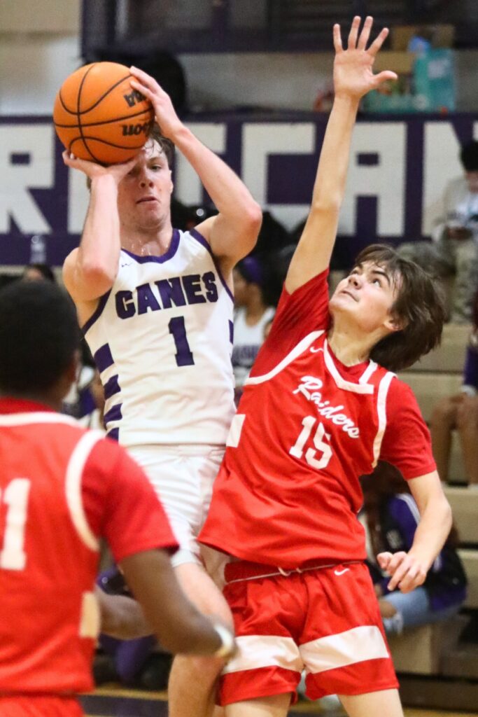 Gainesville's Anthony Leivonen puts up a shot against Santa Fe's Matthew Stevens.