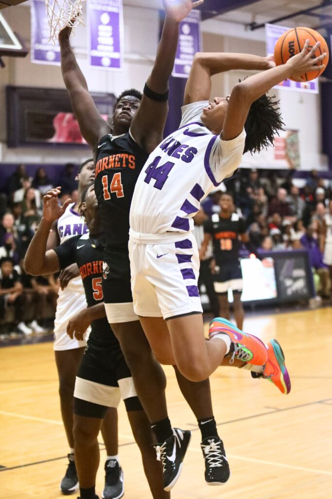 Gainesville's Cordarius White puts up a shot against Hawthorne's Kyler Ingram.