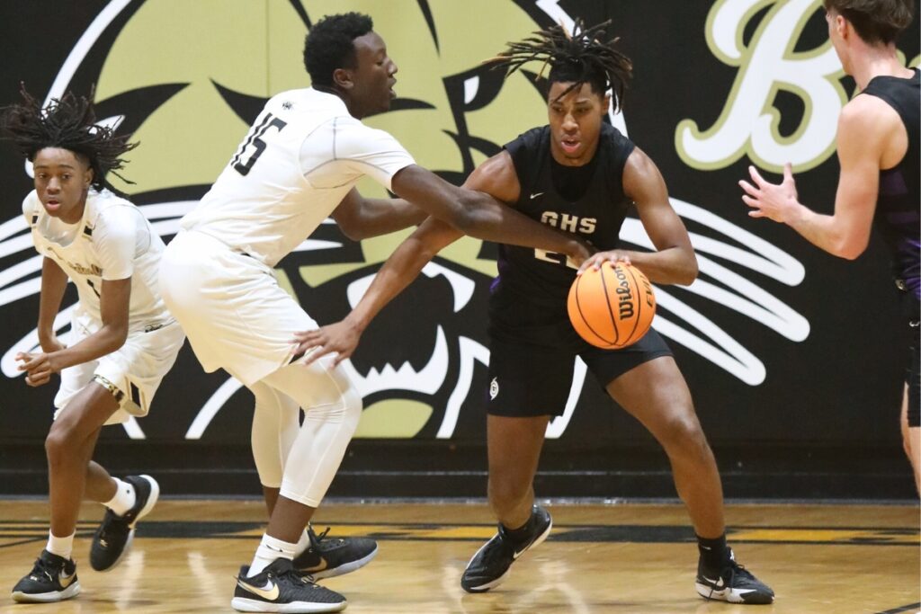 Gainesville's Cornelius White maneuvers past Buchholz's Collin Dunmore.