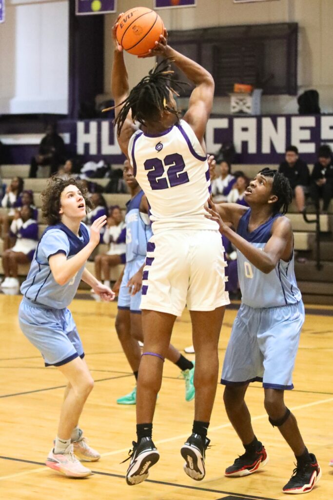 Gainesville's Cornelius White puts up a shot against P.K. Yonge's Joel Washington.