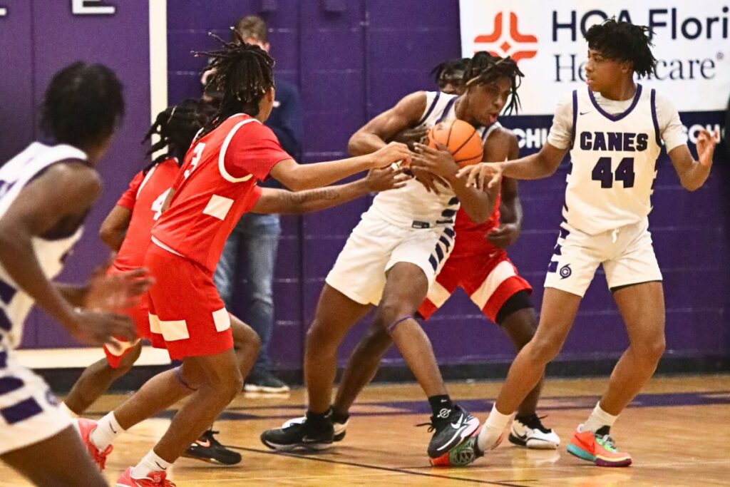 Gainesville's Cornelius White rips away a loose ball against Santa Fe.