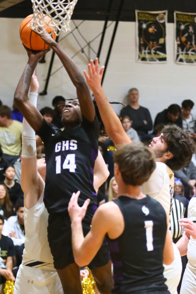 Gainesville's Craig Thomas puts up a shot against Buchholz.