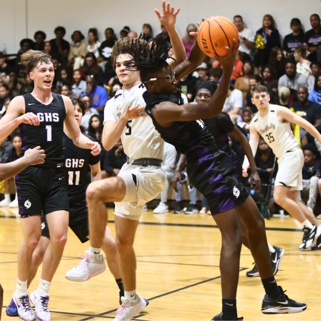 Gainesville's Jordan Dixon pulls down a rebound against Buchholz.