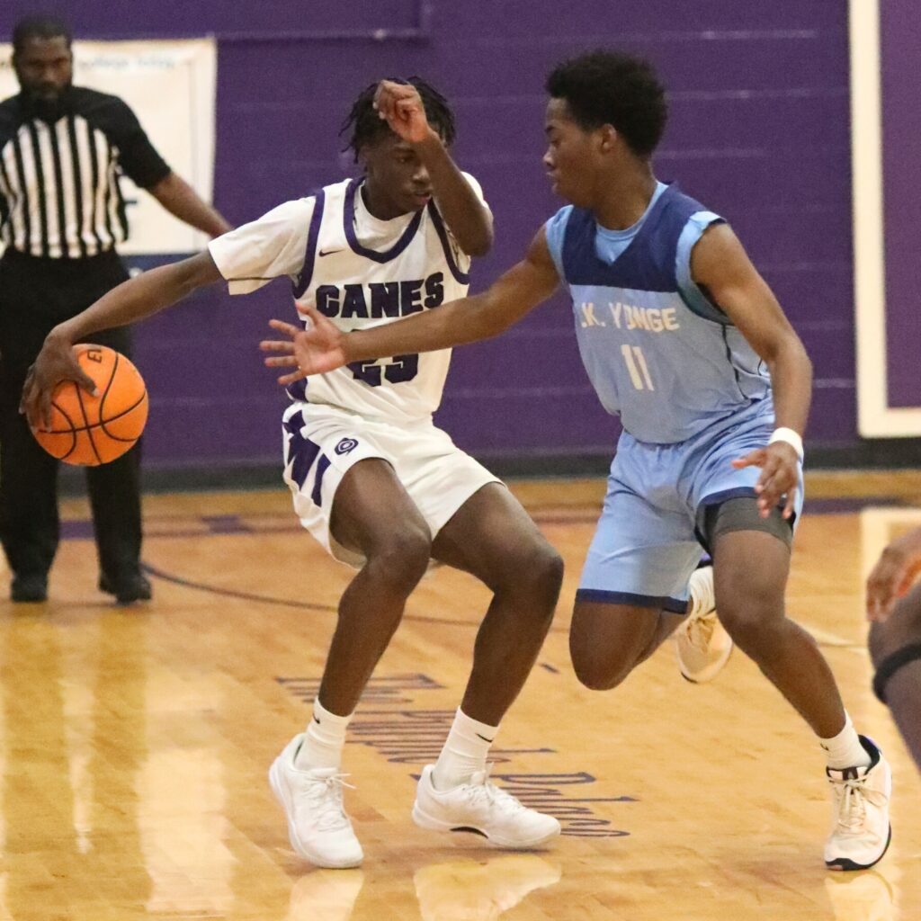 Gainesville's Willie Brooks keeps the ball away from P.K. Yonge's Lorenzo Hill.