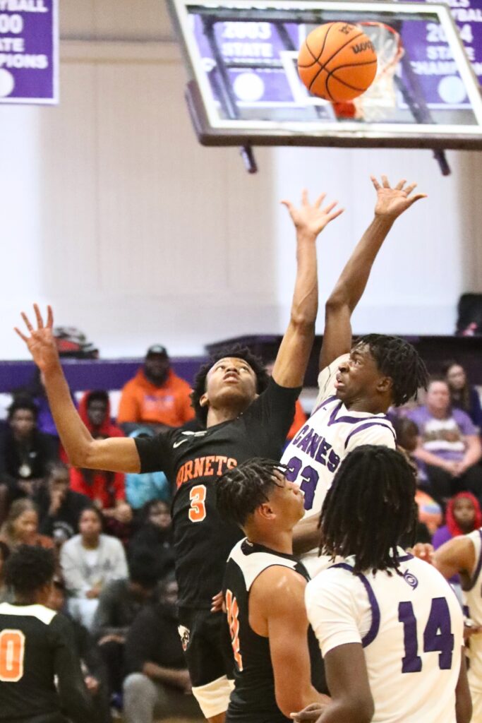 Gainesville's Willie Brooks puts up a shot against Hawthorne's Dacarion Debose.