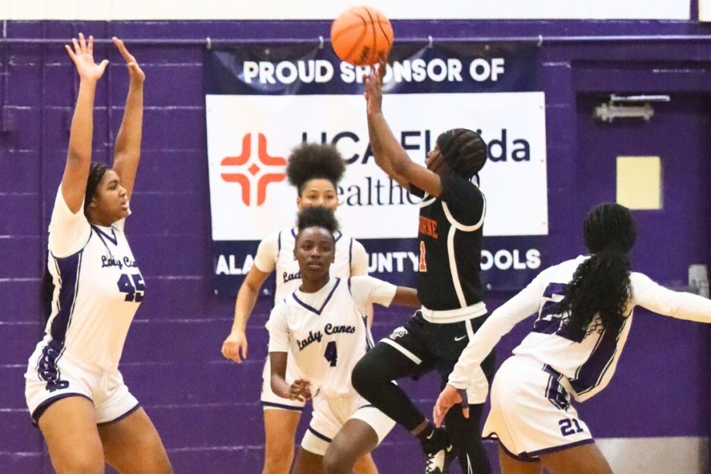 Hawthorne's De' Mya Adams drives to the basket against Gainesville.