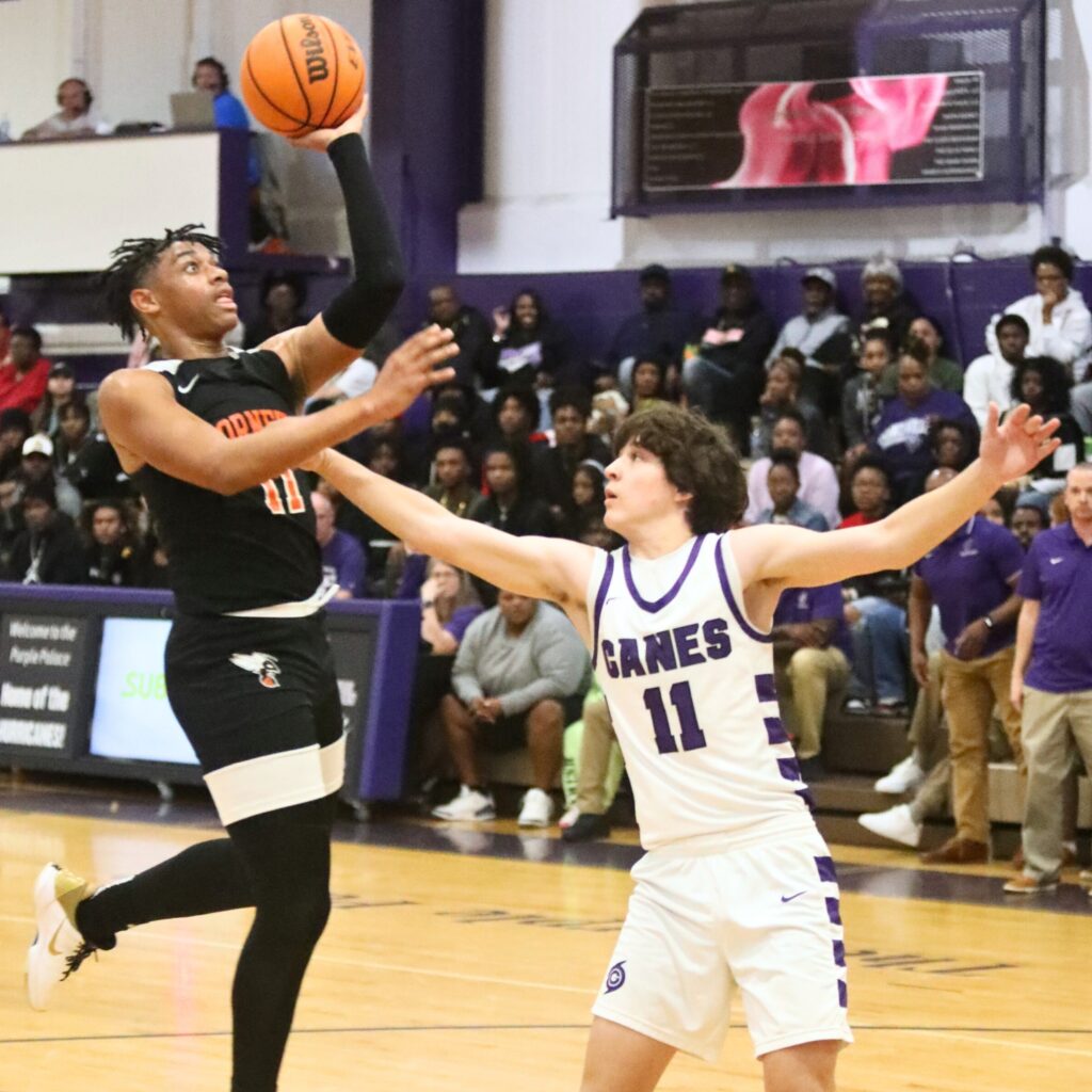 Hawthorne's Leland Johnson takes a shot against Gainesville's Simon Childers.