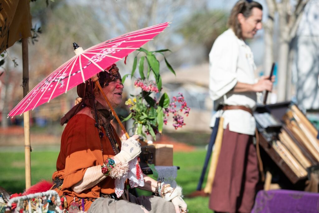 “Looney Lucy” speaks with a faire attendee.