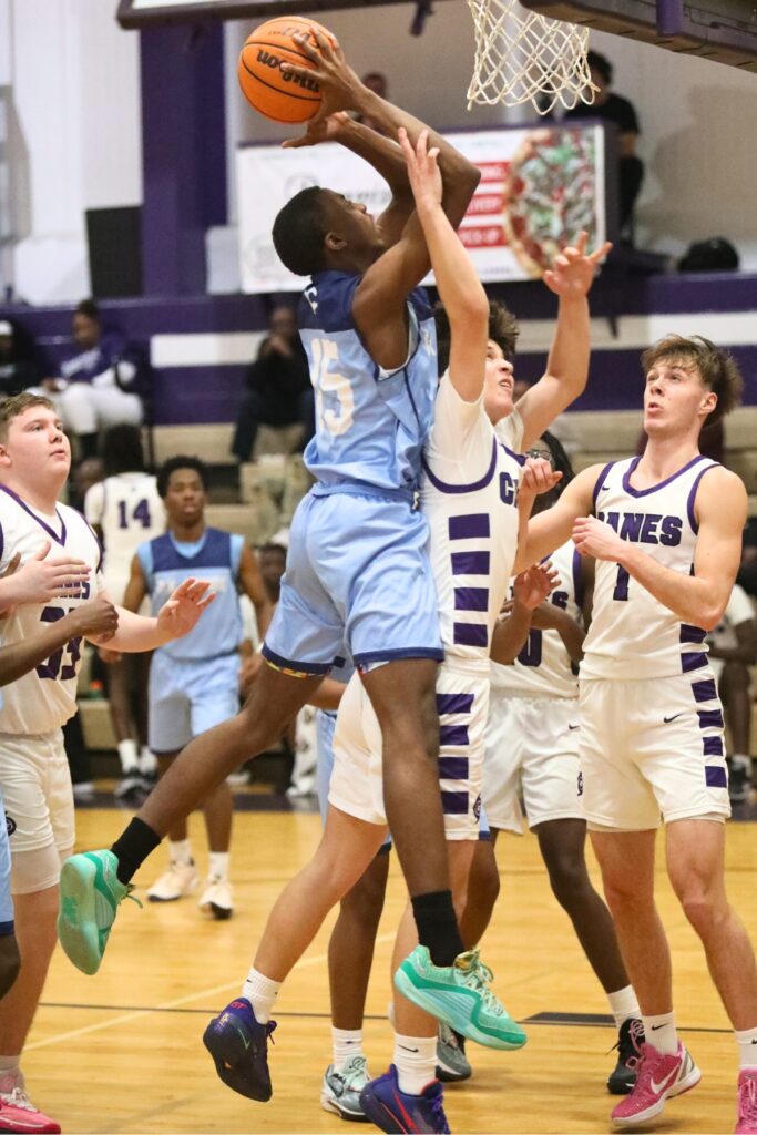 P.K. Yonge's Mareon Bannister takes a shot over Gainesville's Simon Childers.