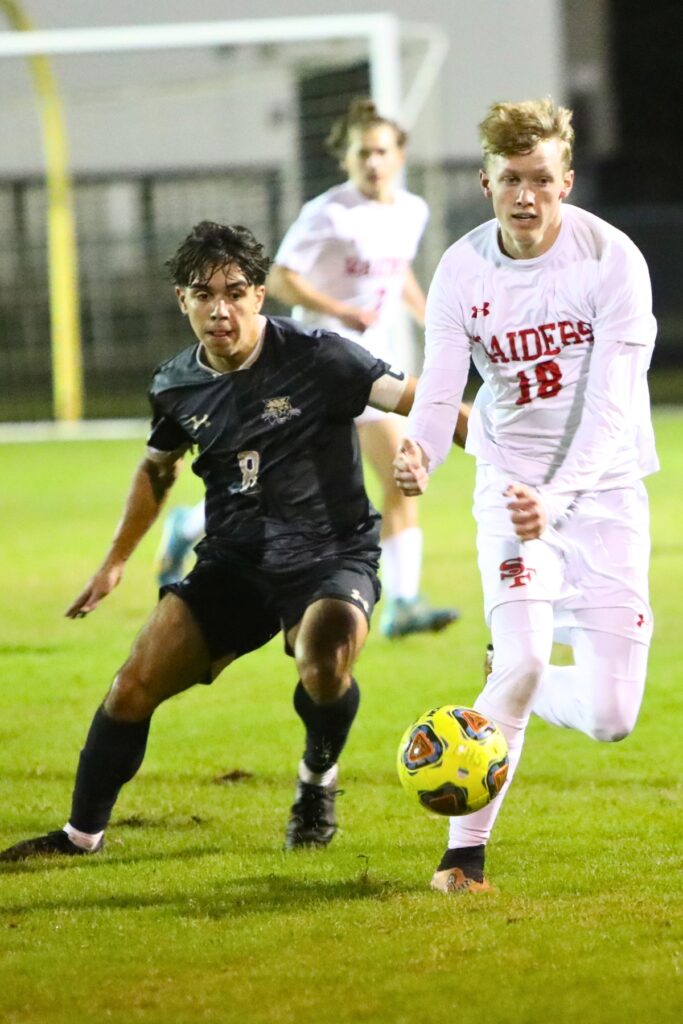 Santa Fe's Brogan Mason gets past Buchholz's Eduardo Fuzy,