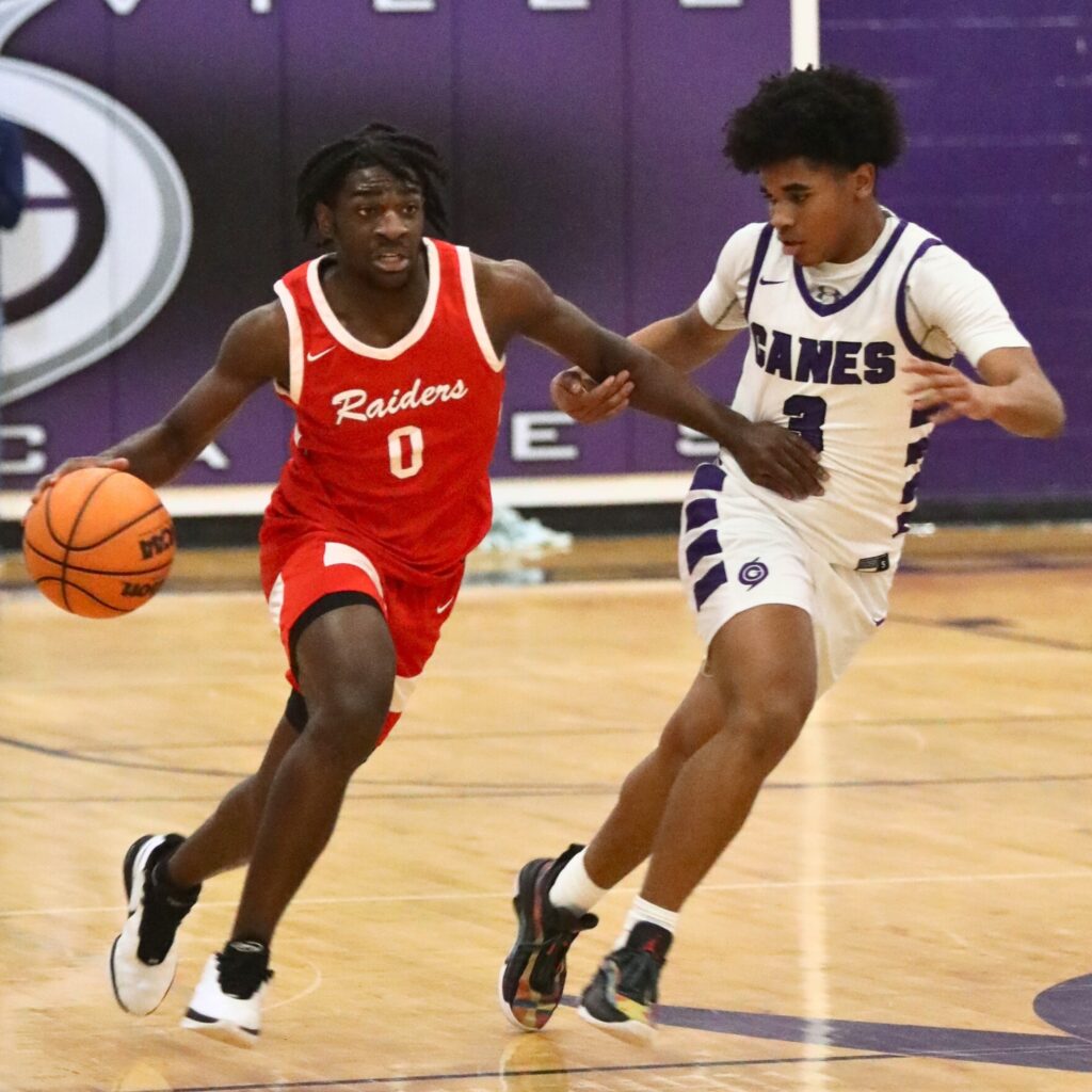 Santa Fe's Nyshaun Jenkins dribbles past Gainesville's Jacob Wright.