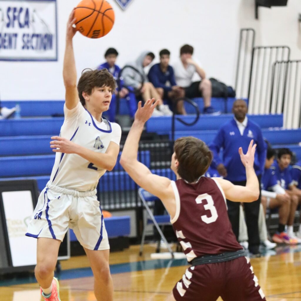 St. Francis Catholic's Liam Banks makes a pass against Oak Hall's Harrison Beach.