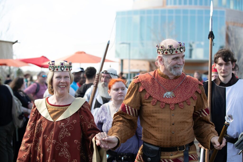 The King and Queen of Hoggetowne, Michael and Fontaine Huey, stroll in the royal procession.
