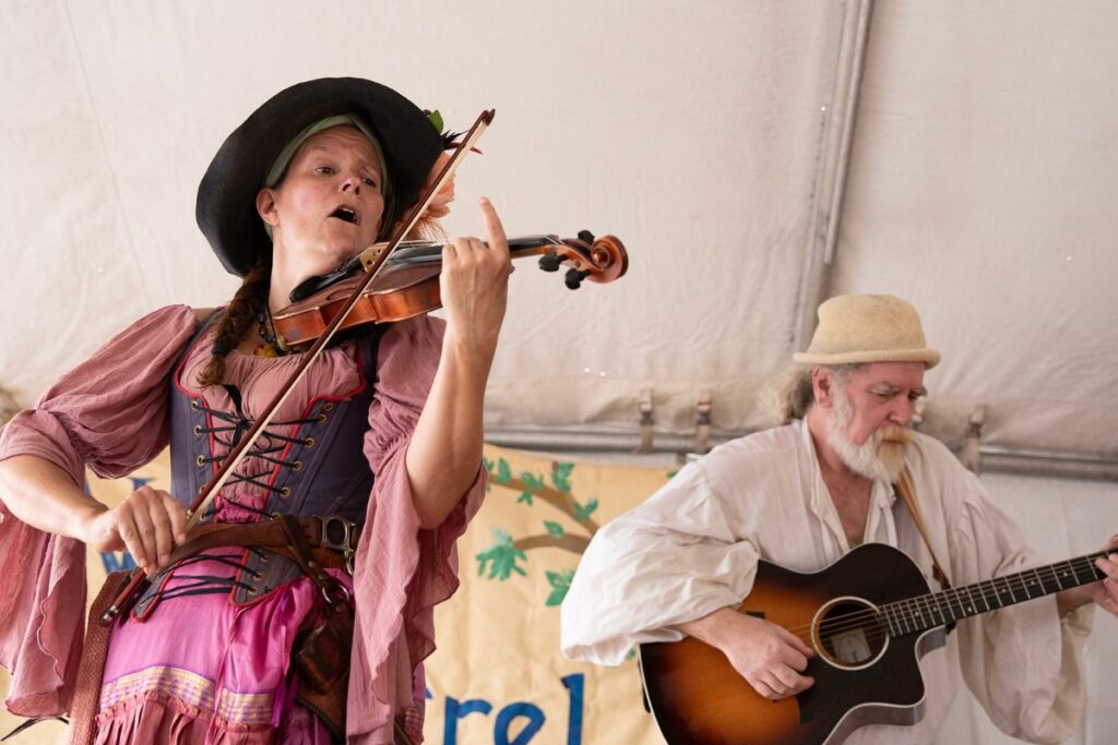 Victoria Scuteri of the New Minstrel Revue plays her fiddle during the band’s set.