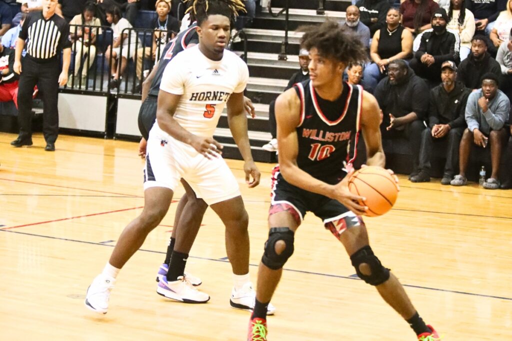 Williston's Kyler Lamb with a rebound against Hawthorne at the Kingdom of the Sun tournament.