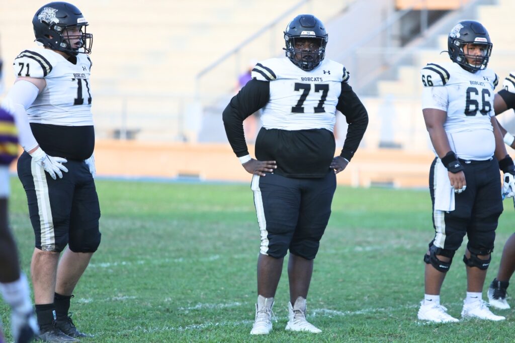 Buchholz's Dylan Lloyd (71), Perris Sylvester (77) and Kain McDonald (66) anchored the Bobcats offensive line in 2023.