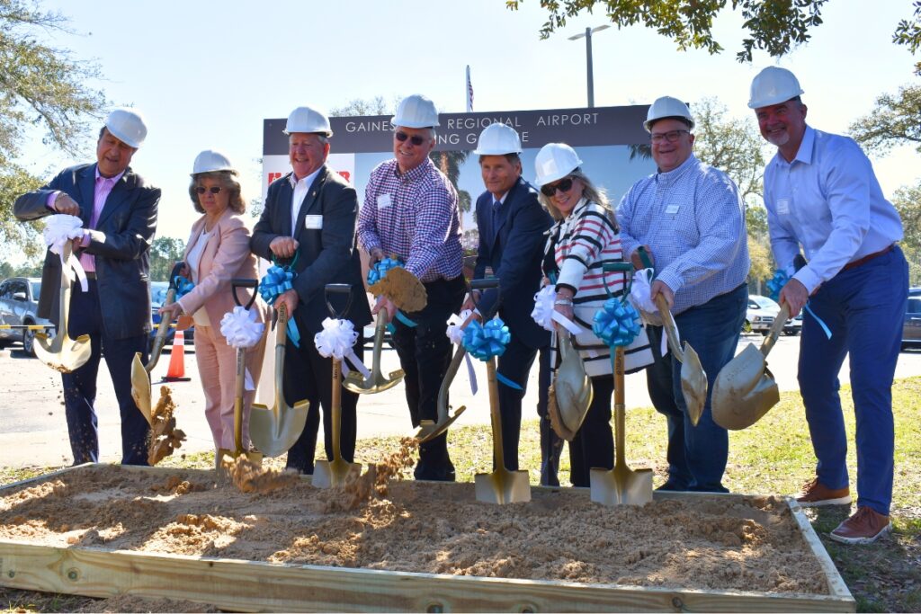 Current and former members of the GACRAA board break ground for the Gainesville Regional Airport parking garage.