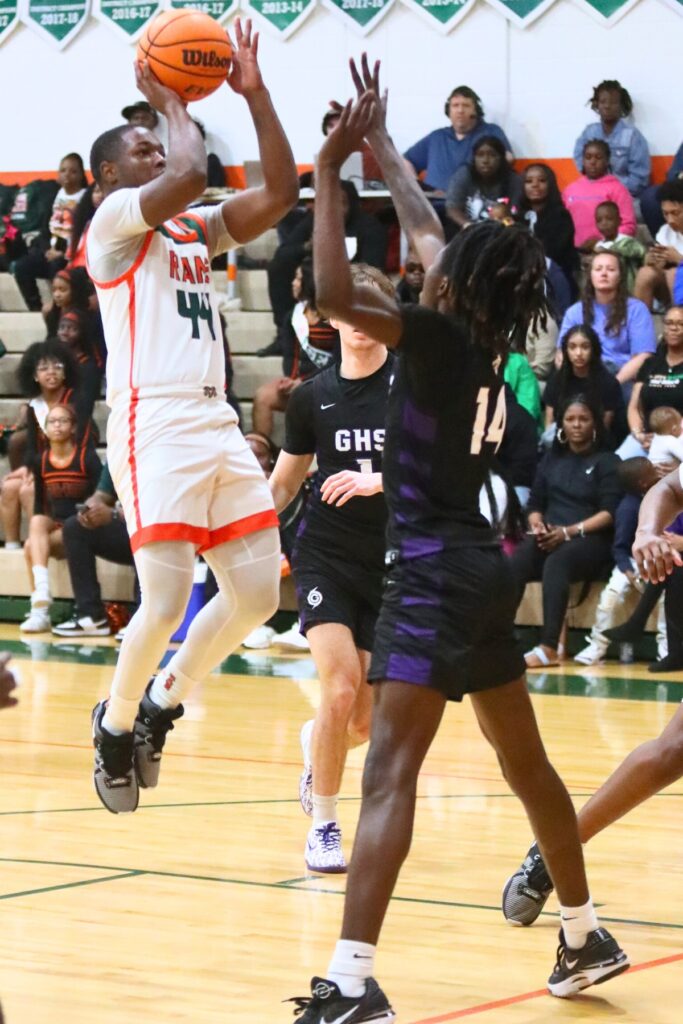 Eastside's Kamariyon Mack takes a shot over Gainesville's Craig Thomas.