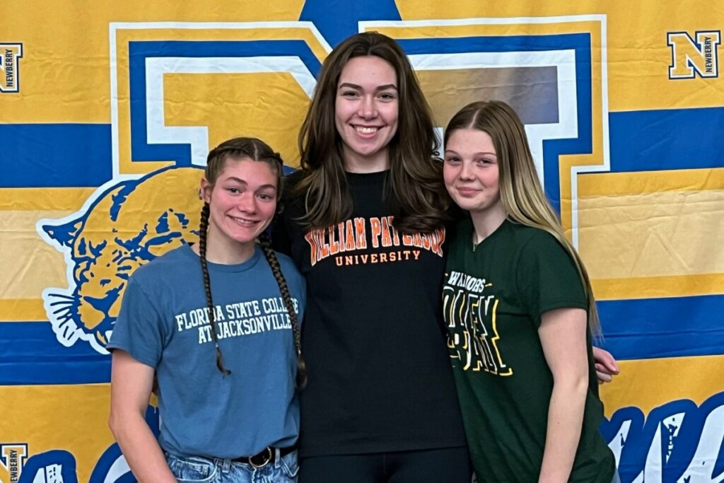 (From left) Newberry's Hailey Tharp, Sarah Watson and Hanna Templeton signed their national letters of intent to play college volleyball on Tuesday.