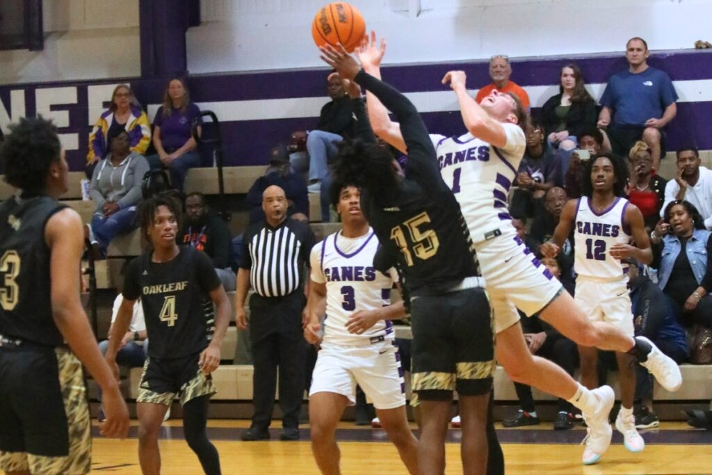 Gainesville's Anthony Leivonen gets fouled by an Oakleaf player.