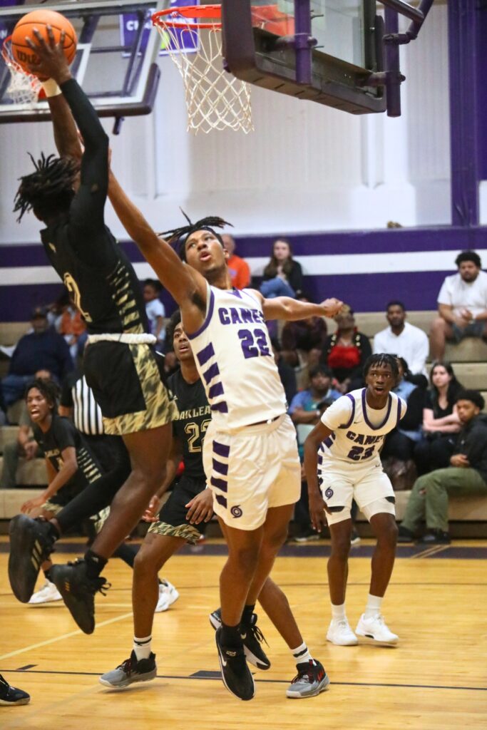 Gainesville's Cornelius White attempts to block an Oakleaf shot.