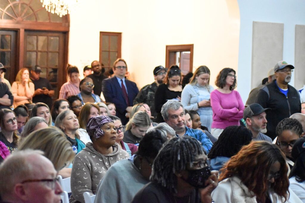 Newberry schools parents and teachers lined up with questions at the town hall meeting.
