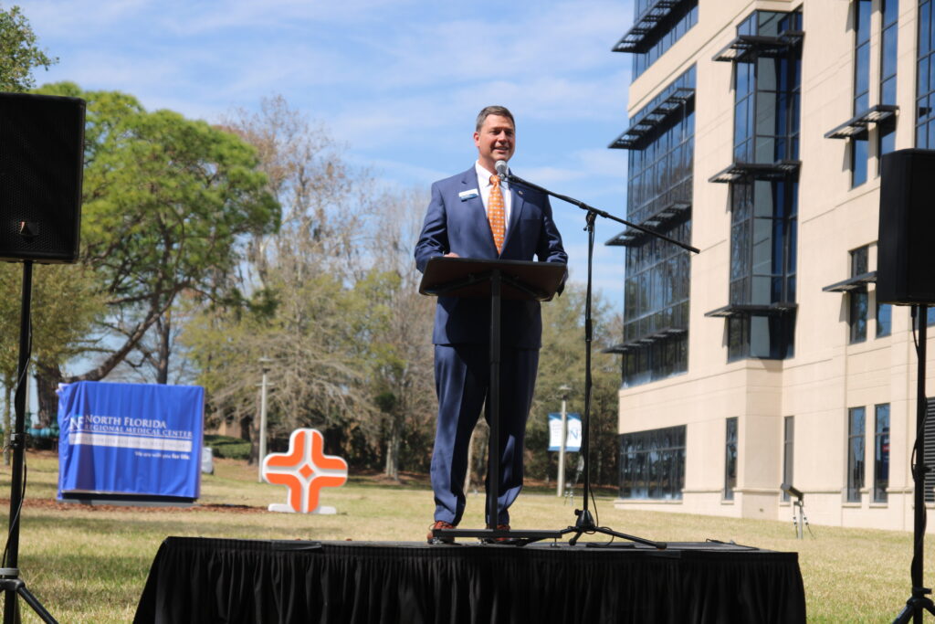 North Florida Hospital CEO Eric Lawson speaks at the hospital's name change unveiling in 2022.